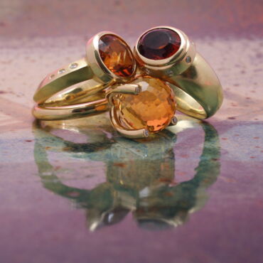 Drei Ringe aus 750er Gelbgold,Brillanten und Citrinen